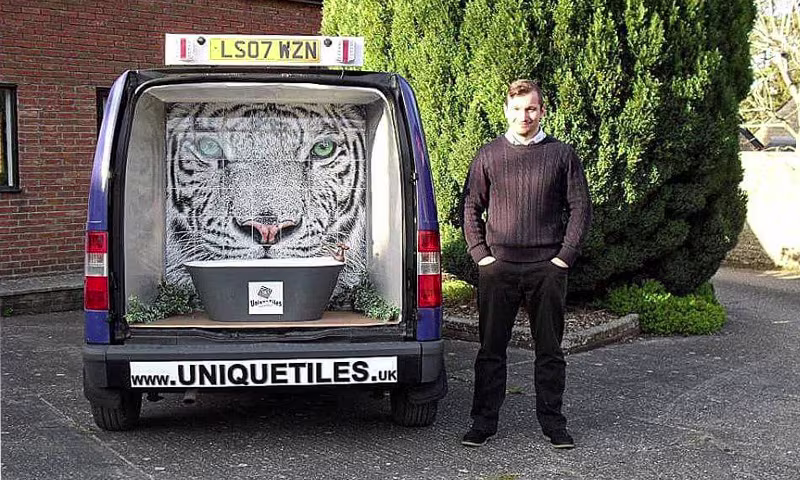 Unique tiles van displaying tiger mural.